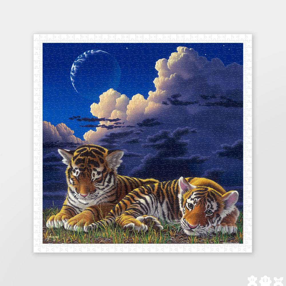 This captivating 900-piece puzzle features two tiger cubs nestled closely, basking in the peacefulness of night. Feel the warmth and comfort of this tender scene as you complete each piece.