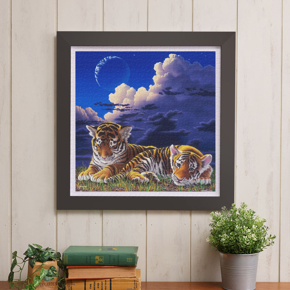 This captivating 900-piece puzzle features two tiger cubs nestled closely, basking in the peacefulness of night. Feel the warmth and comfort of this tender scene as you complete each piece.