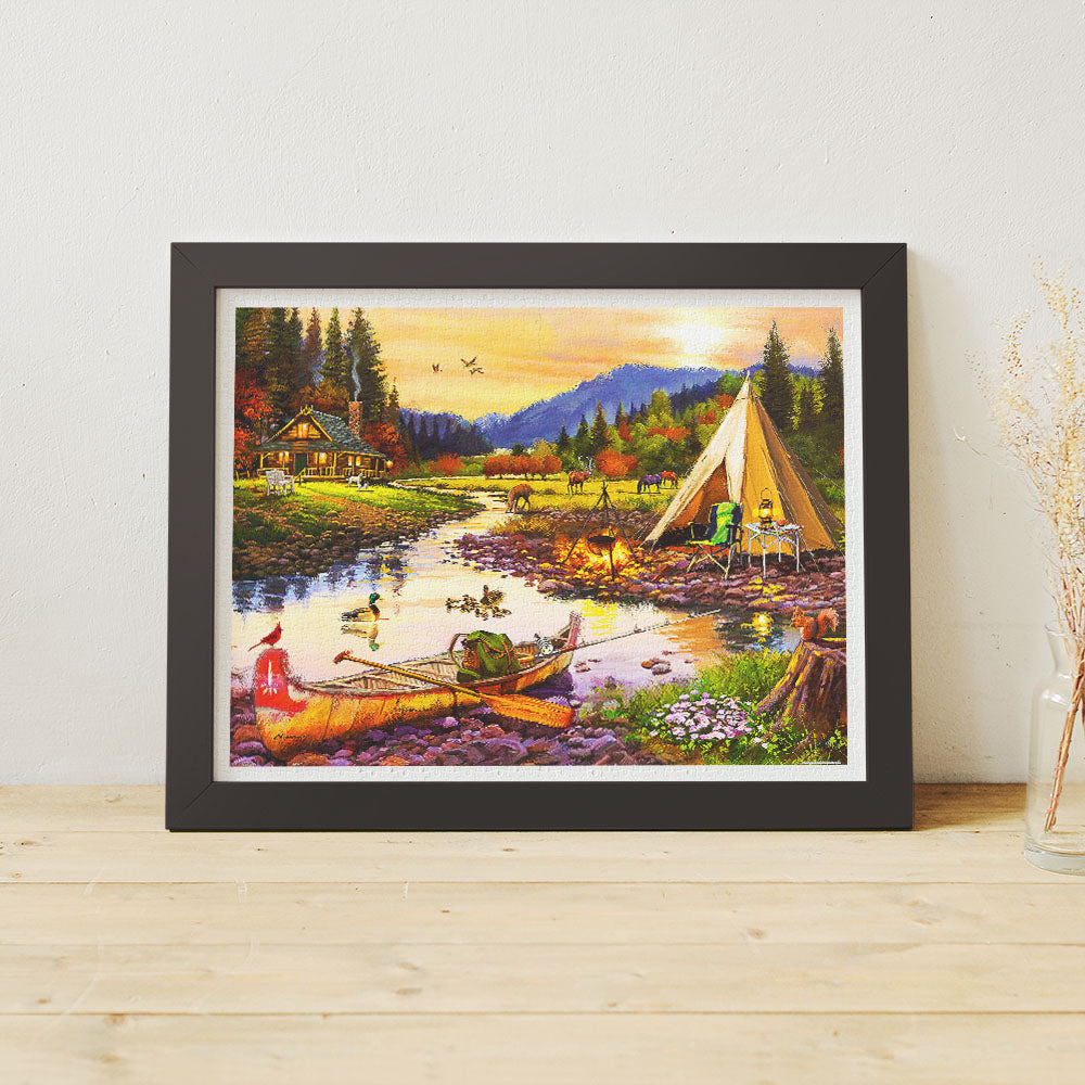 This 1200-piece puzzle beautifully captures a serene riverside campsite at sunset, with cozy cabins, peaceful waters, and wildlife all around.