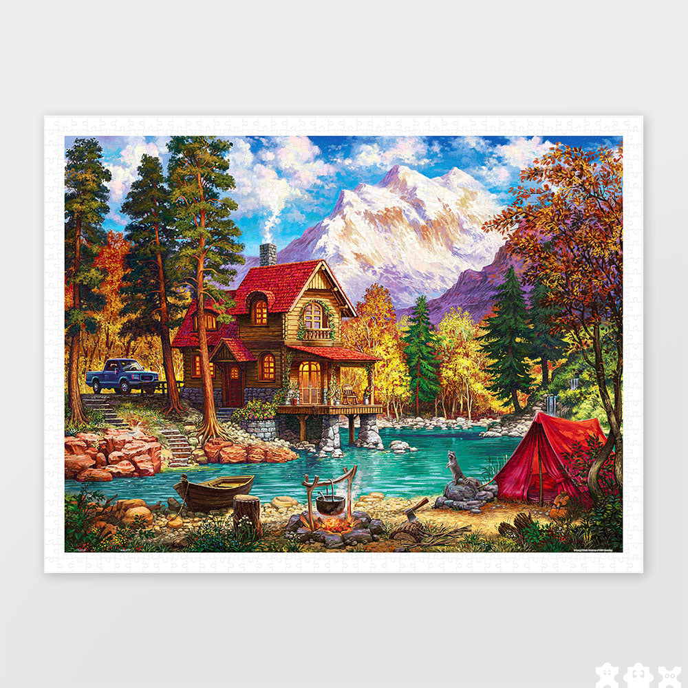 PieceRelax | 1200 piece puzzle. Escape to tranquility with PieceRelax puzzle. This picturesque scene includes a cozy cabin by the lake and a majestic mountain backdrop. 