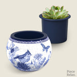 PieceRelax Puzzle Planter- This exquisite planter showcases intricate blue birds and delicate floral patterns, perfect for adding a touch of elegance to your indoor garden. With PieceRelax Puzzle Planter, every piece falls into place beautifully, ensuring you'll always get there.