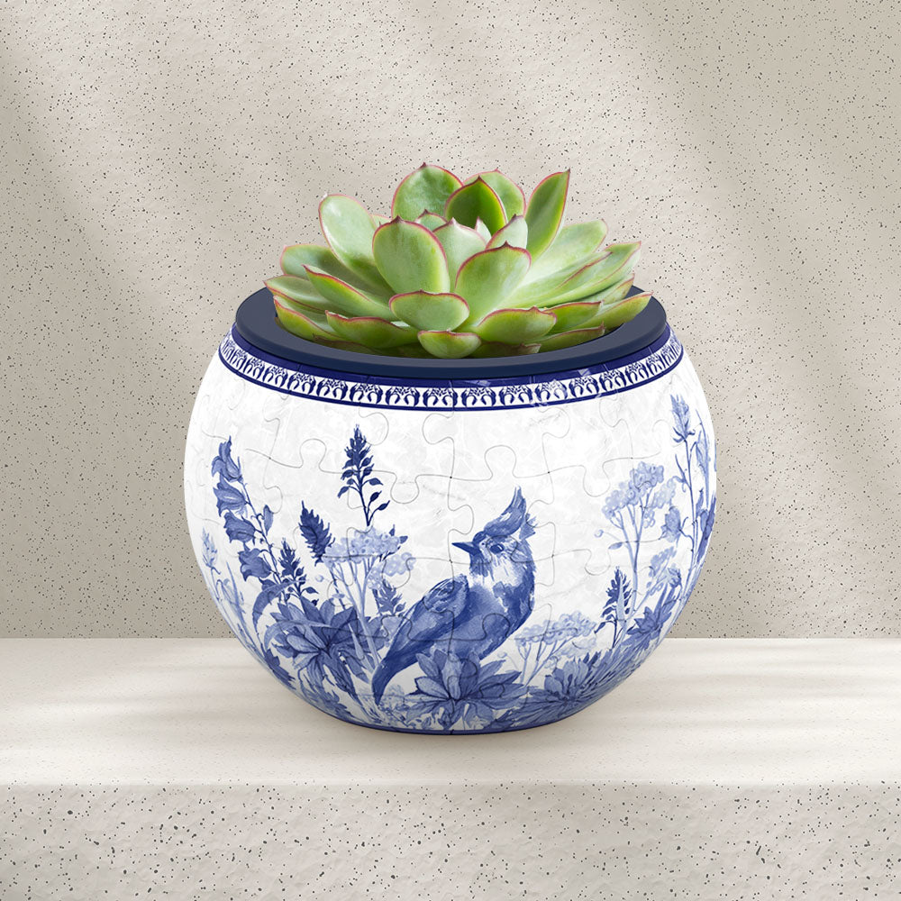 PieceRelax Puzzle Planter- This exquisite planter showcases intricate blue birds and delicate floral patterns, perfect for adding a touch of elegance to your indoor garden. With PieceRelax Puzzle Planter, every piece falls into place beautifully, ensuring you'll always get there.