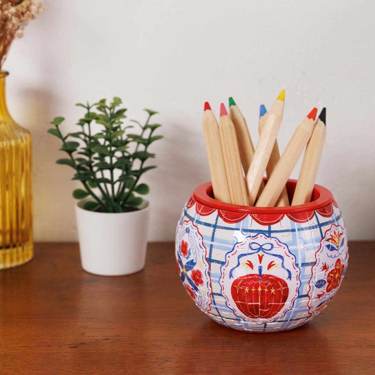 Meet your home’s next essential piece. This cute, hand-drawn puzzle planter brings a delightful pop of playful style and green life to any space.