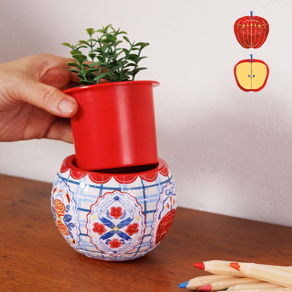 Meet your home’s next essential piece. This cute, hand-drawn puzzle planter brings a delightful pop of playful style and green life to any space.