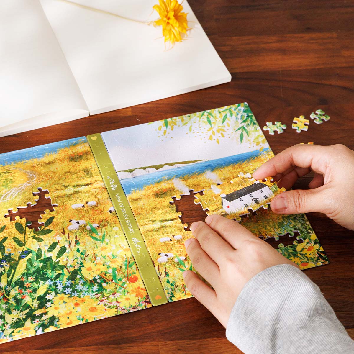 Gaze at the majestic Seven Sisters cliffs across a beautiful field of yellow blooms. A stunning coastal escape for your home.